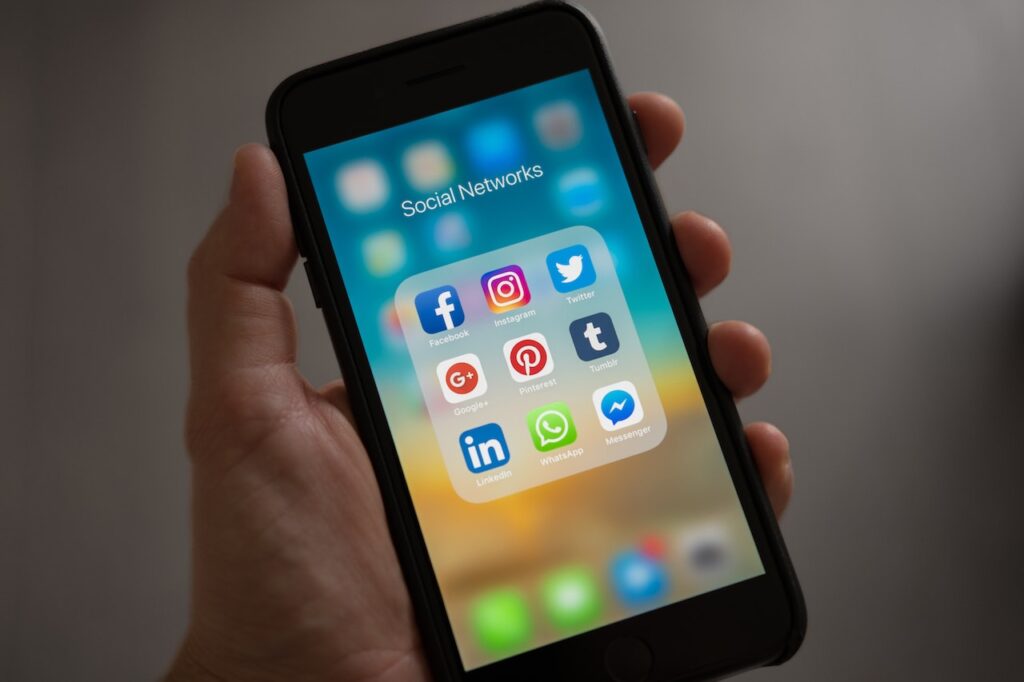 Phone with social media apps on the screen